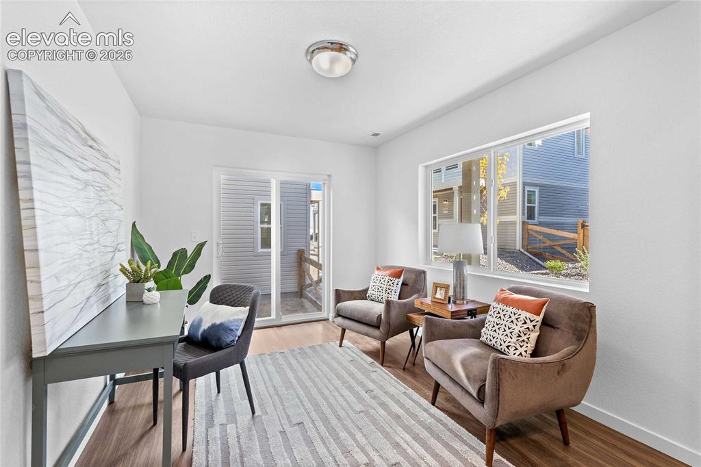 Image 5 of 25: Recessed lighting, wood-finish flooring, large window, sliding glass door,