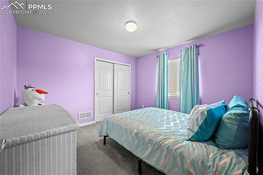 Image 14 of 24: 3rd upper level bedroom