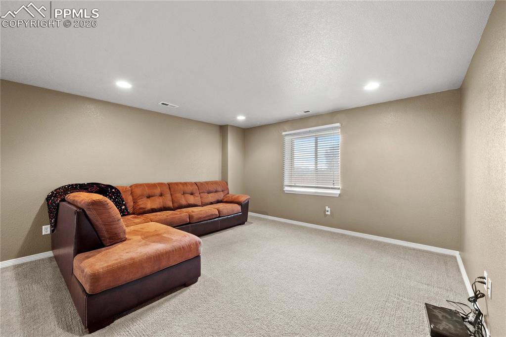 Image 18 of 24: Large basement family room