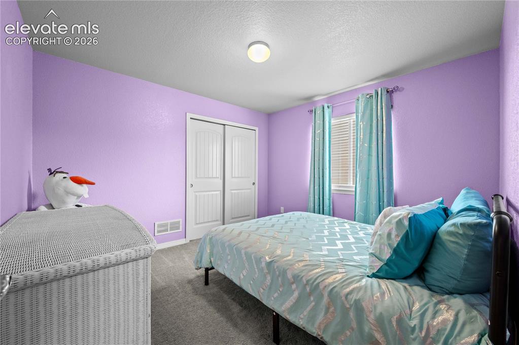 Image 20 of 23: 3rd upper level bedroom