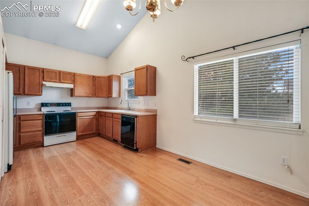 Image 10 of 45: Expansive entryway featuring a two-story arched window, plush carpeting, a 