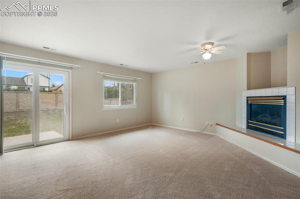 Image 16 of 45: Vaulted ceiling dining area featuring wood-finish flooring and a multi-arm 