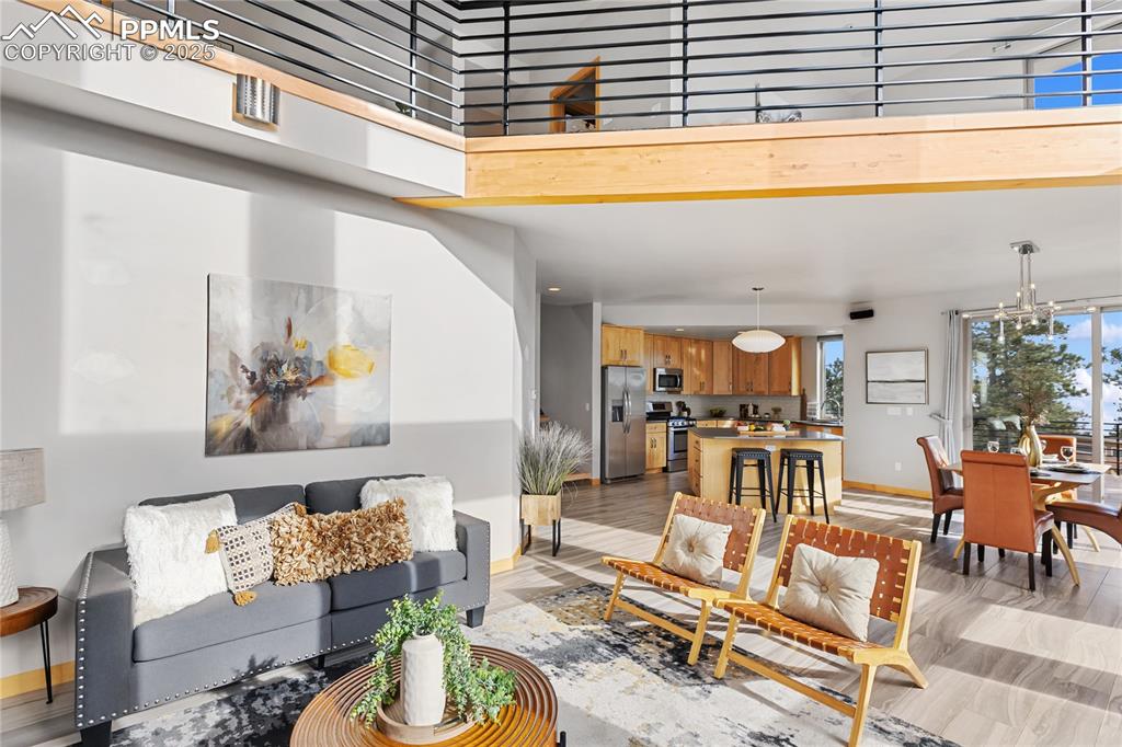 Image 10 of 43: So much beautiful Colorado sunshine flooding into the home