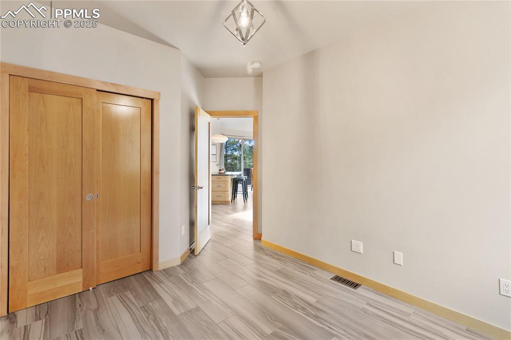 Image 20 of 43: Main level bedroom