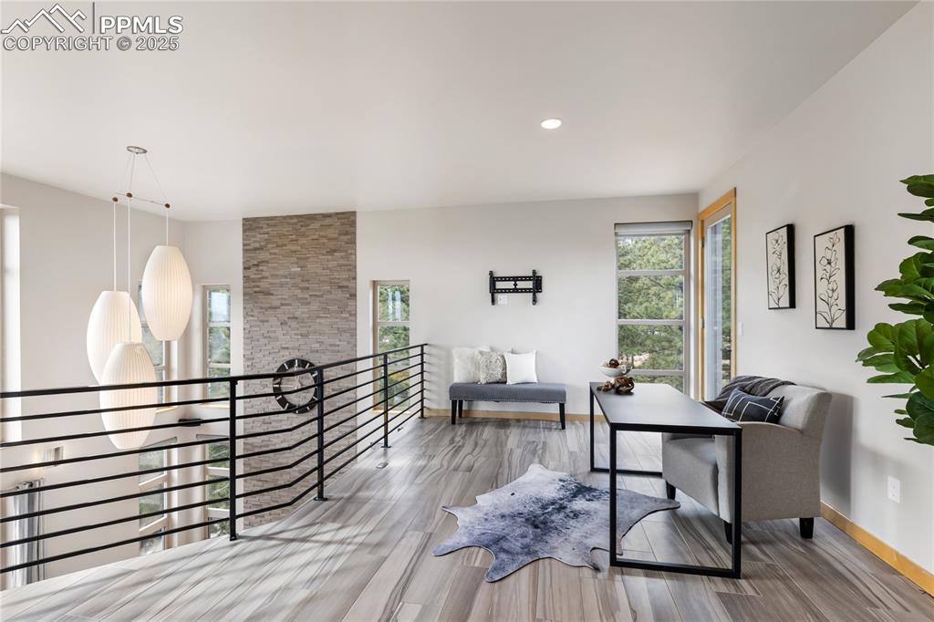 Image 32 of 43: Plenty of room for a home office, even a work out nook, and another deck of