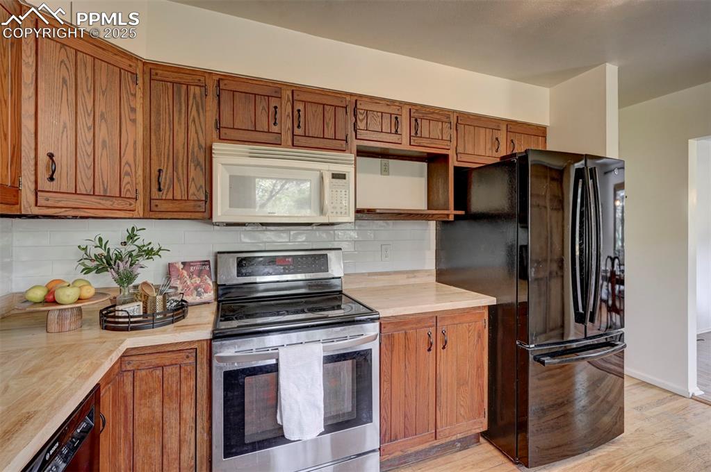 Image 19 of 50: Appliances include a new dishwasher, range oven, microwave, and French door