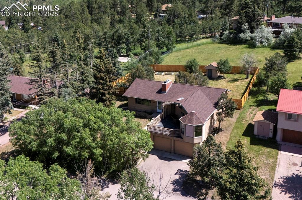 Image 2 of 50: Perfectly situated on a .28-acre treed lot with sweeping mountain views