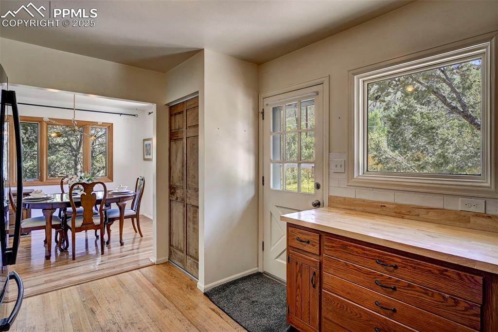 Image 20 of 50: View of the Formal Dining Room from the Kitchen.