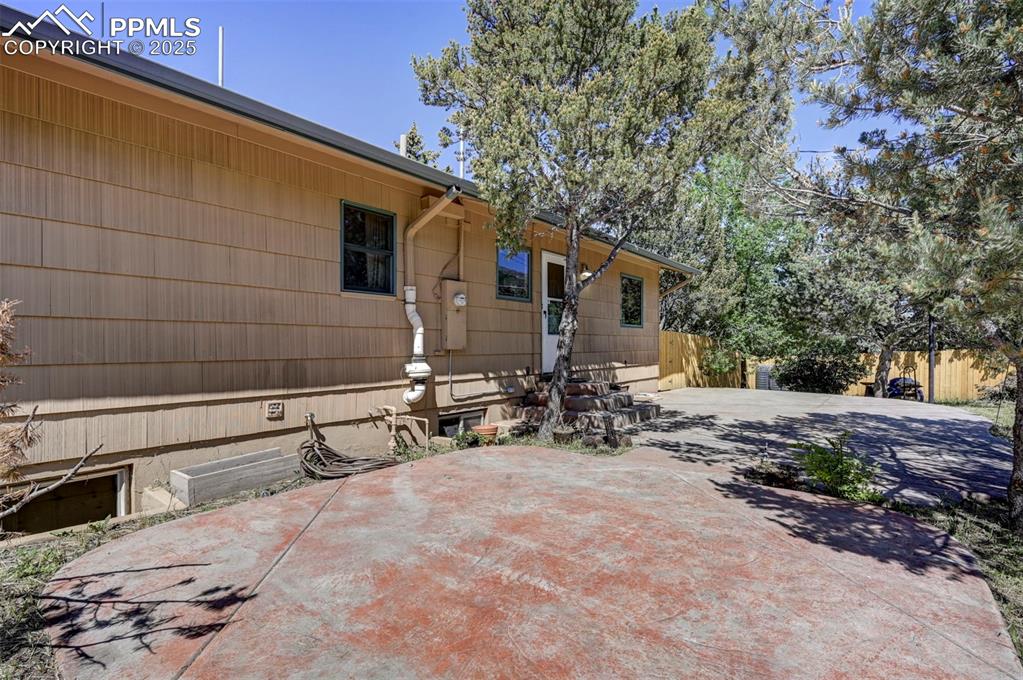 Image 22 of 50: The private backyard patio is perfect for relaxing or entertaining.