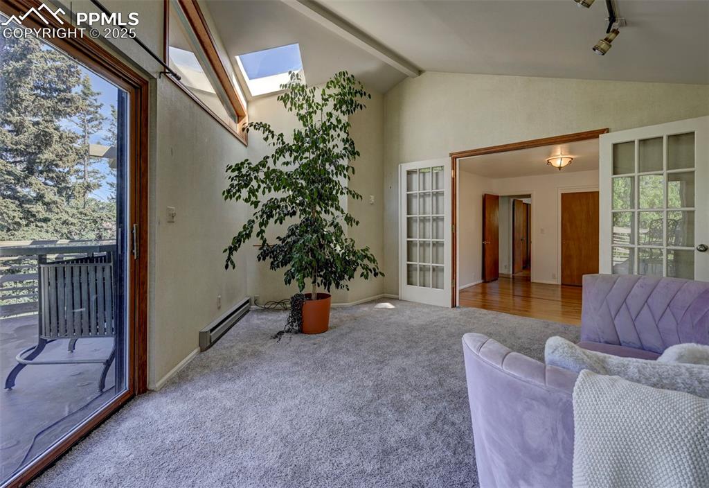 Image 27 of 50: View into the Primary Bedroom from the Sitting Room.