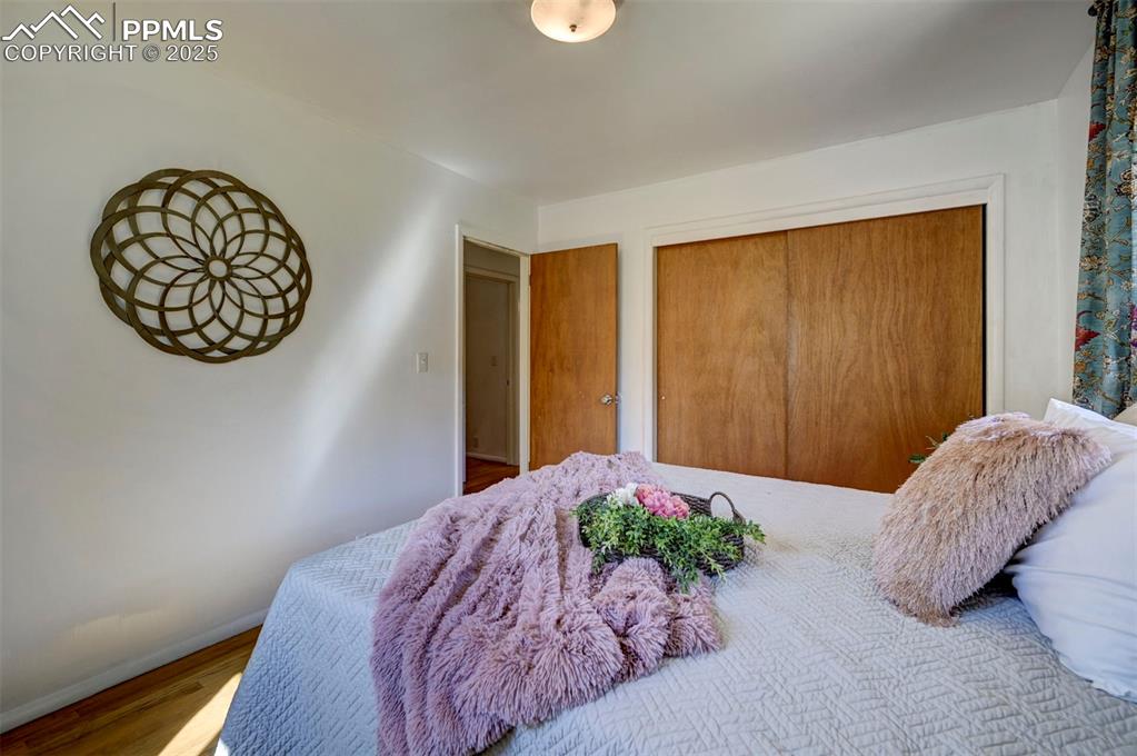 Image 32 of 50: Main Level Bedroom #2 has a generous closet for storage.