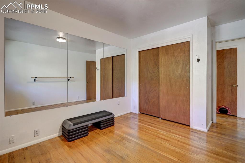 Image 36 of 50: Main Level Bedroom #3 has a generous closet.