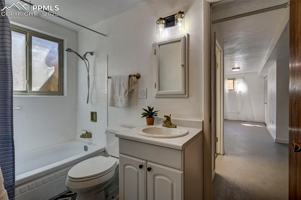 Image 43 of 50: Garden Level Basement Bathroom with vanity, framed mirror/medicine cabinet