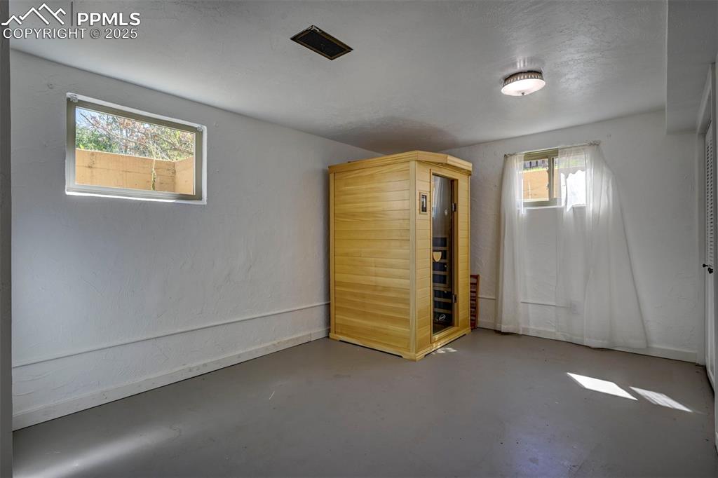 Image 44 of 50: Garden Level Basement Bedroom #5 (sauna not included).