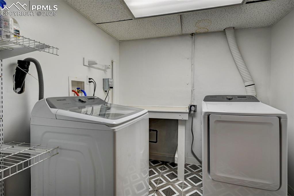 Image 45 of 50: Laundry Room with washer and dryer that stays.