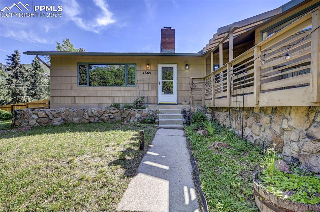 Image 5 of 50: Front walkway and storm door into the home.