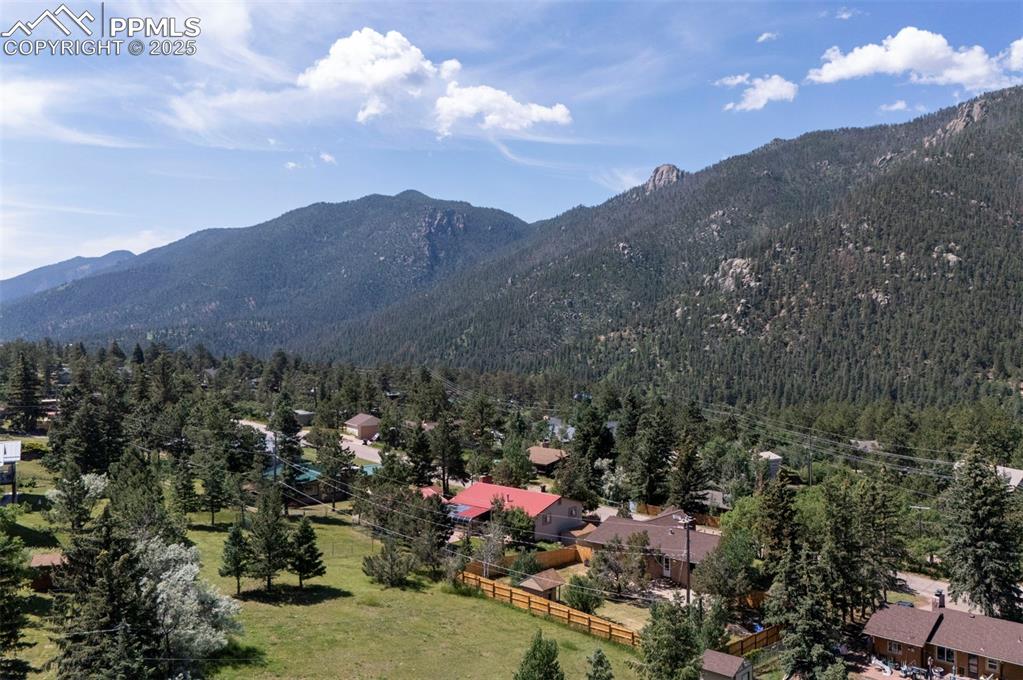 Image 50 of 50: Aerial rear view of the house with no neighbors behind and gorgeous mountai
