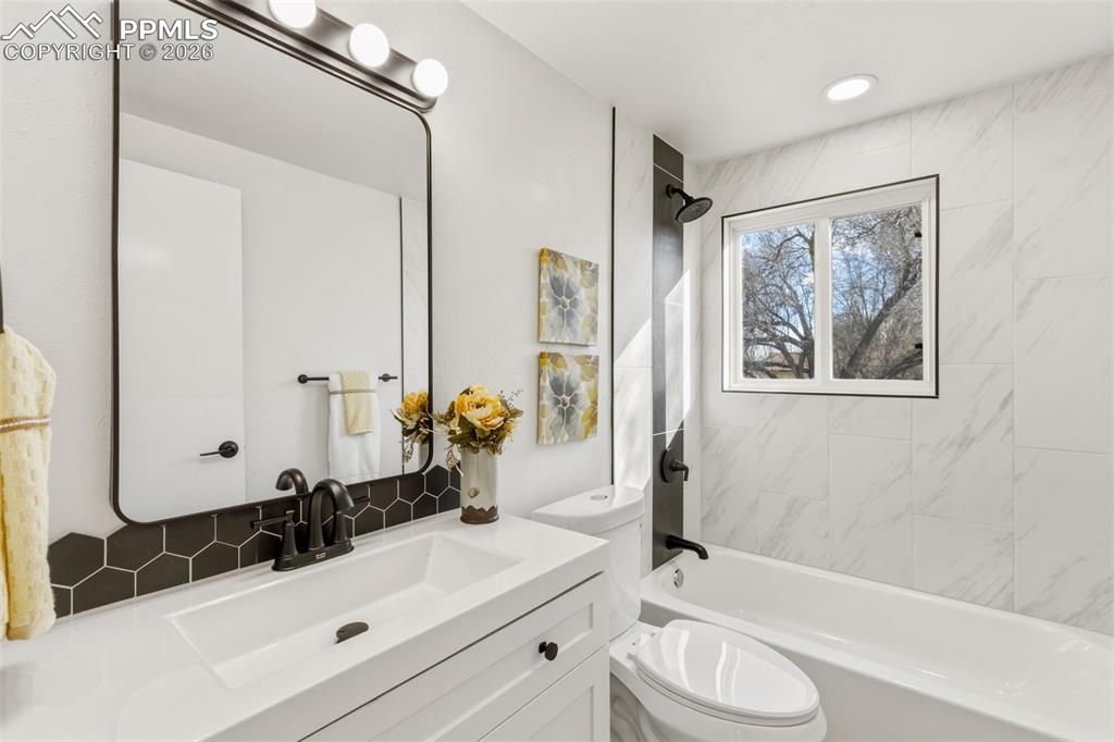 Image 18 of 35: Stylish full bath refresh