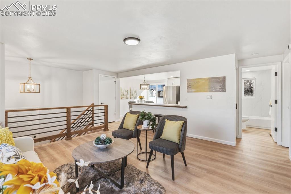 Image 9 of 35: Seamless living-to-kitchen flow