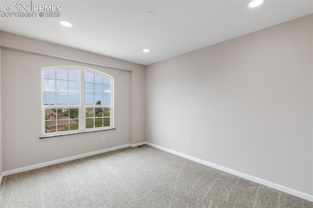 Image 24 of 41: Carpeted empty room with recessed lighting