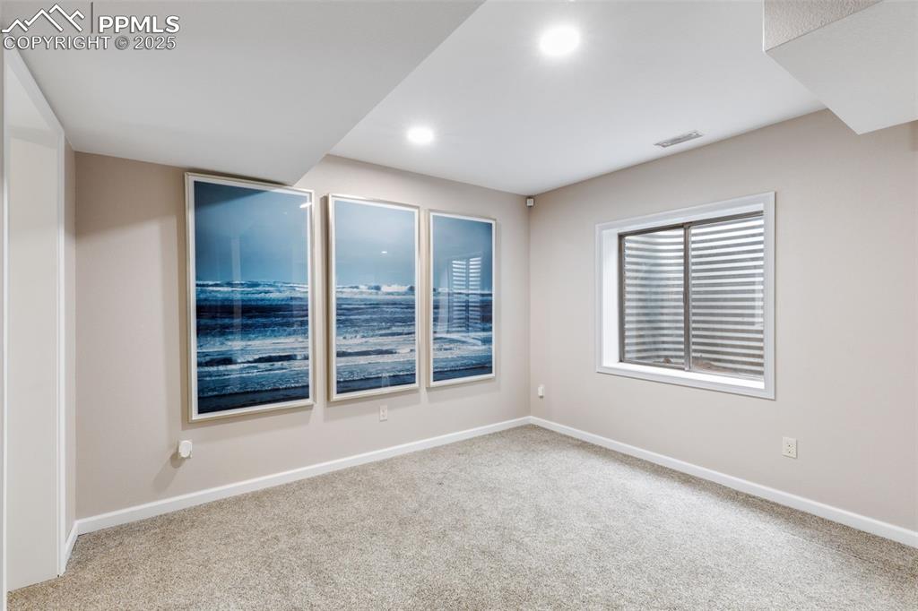 Image 28 of 41: Carpeted empty room featuring baseboards and recessed lighting