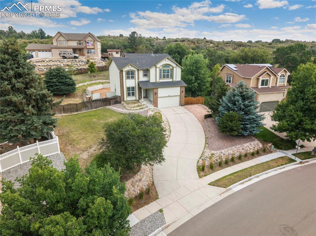 Image 4 of 41: View of front of house featuring driveway and a garage