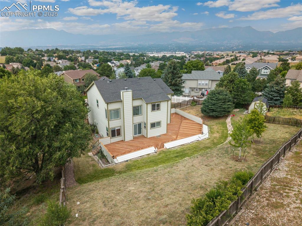 Image 41 of 41: Aerial perspective of suburban area with mountains