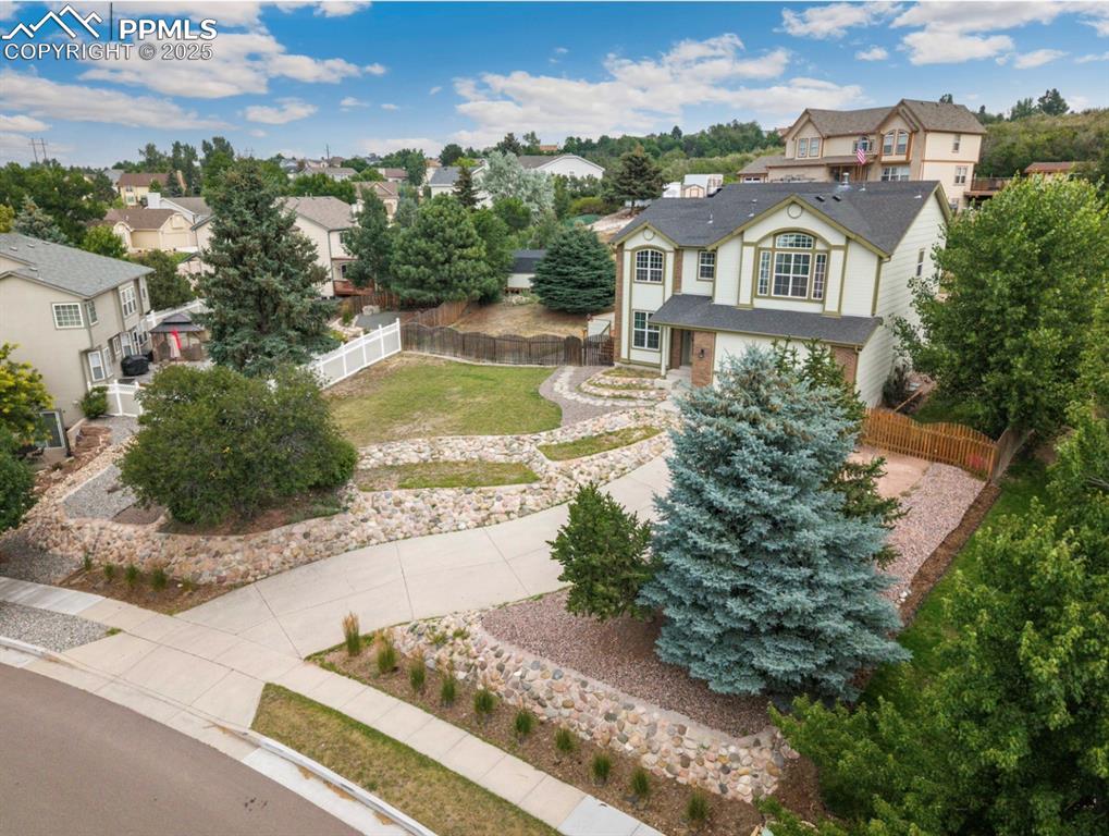 Image 5 of 41: View of front facade with a residential view and driveway
