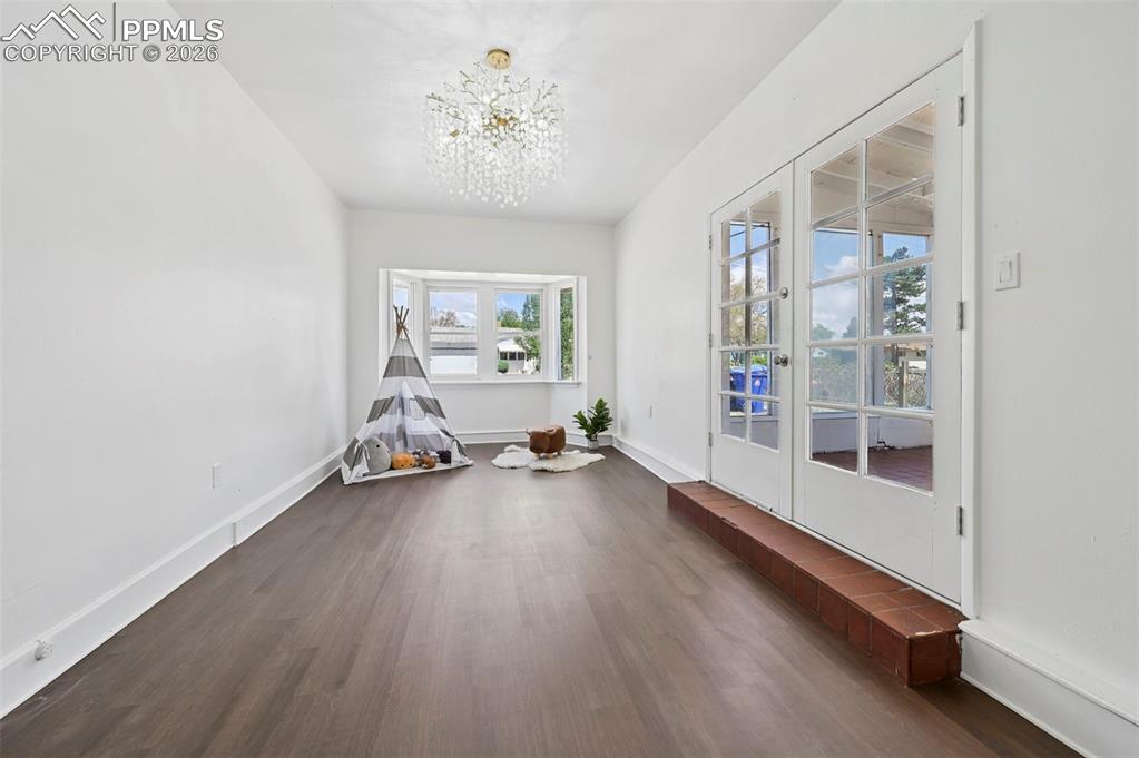 Image 13 of 21: 3rd bedroom.  With attached Sunroom.  