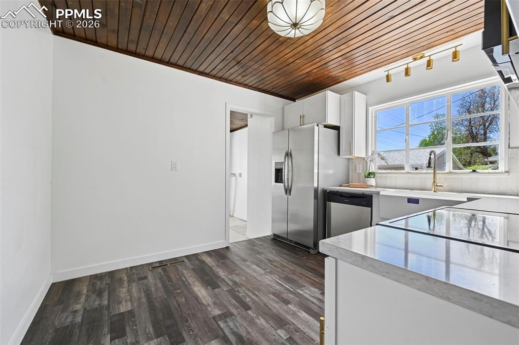 Image 4 of 21: Kitchen with enough room for an eating nook.  