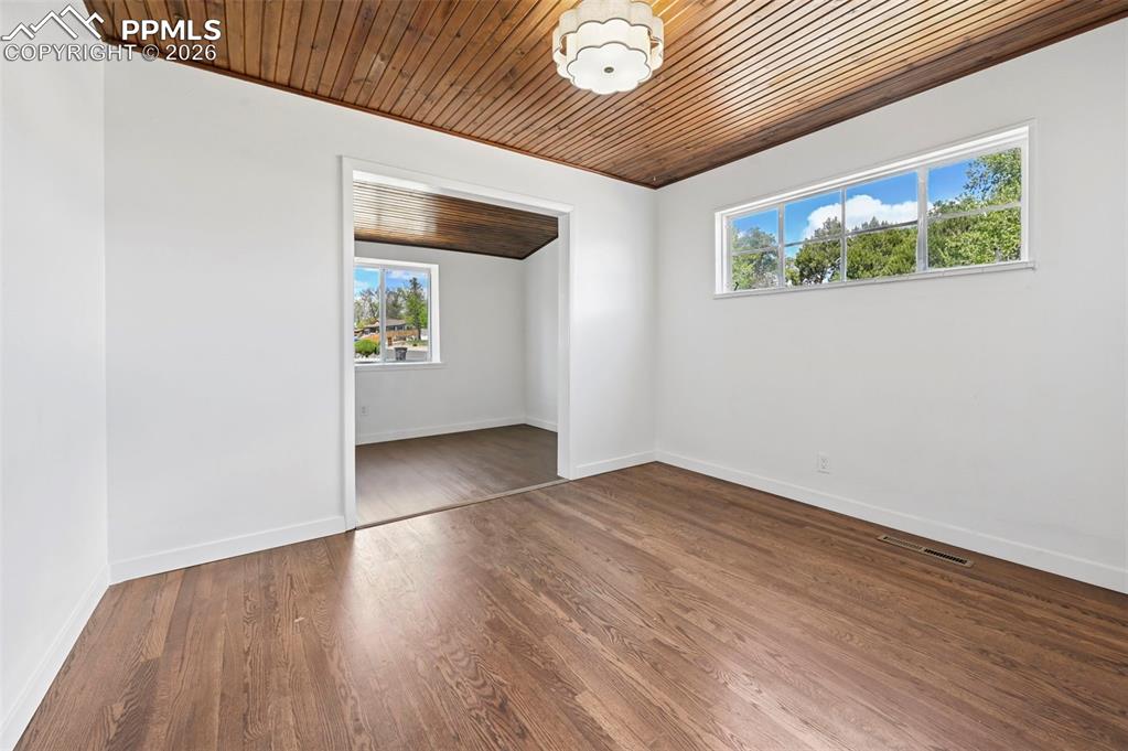 Image 9 of 21: Primary bedroom with extra room for nursery, dressing room, or extra closet