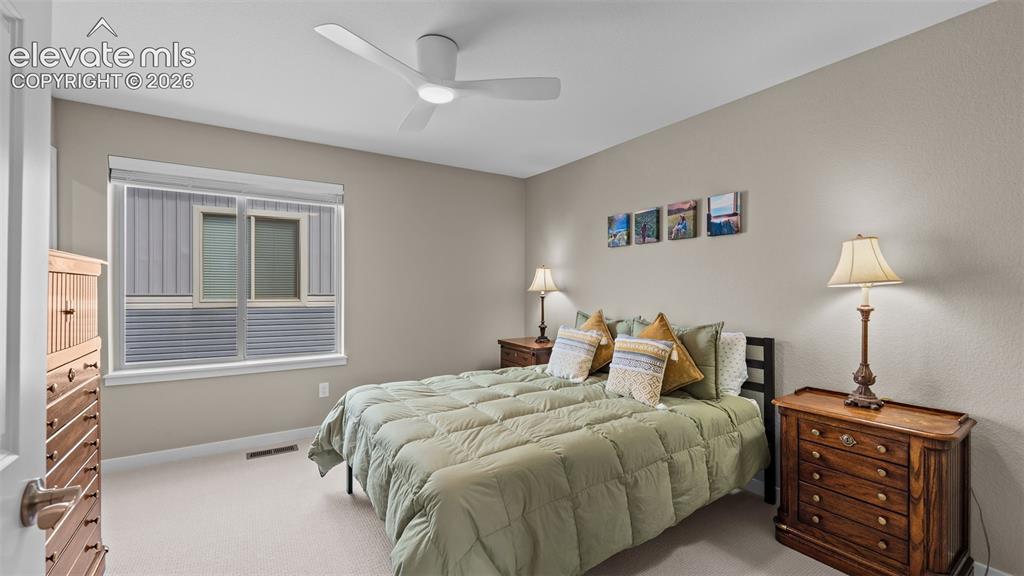 Image 20 of 46: Upper level bedroom.