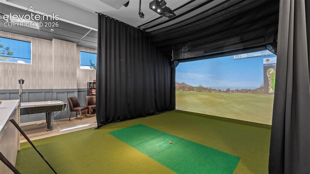 Image 29 of 46: Golf simulator in the community clubhouse.