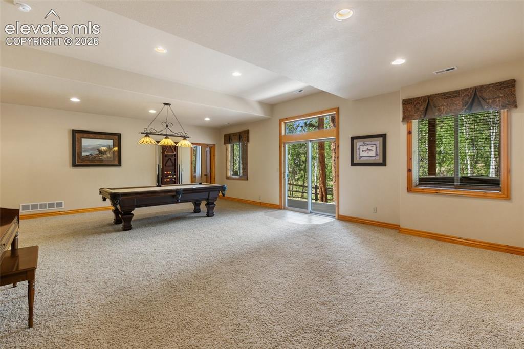 Image 29 of 50: Very spacious family room in the lower level.