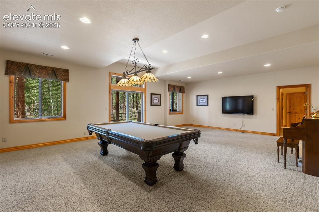 Image 31 of 50: Pool table, piano and TV all included as well as the billiard light and wal
