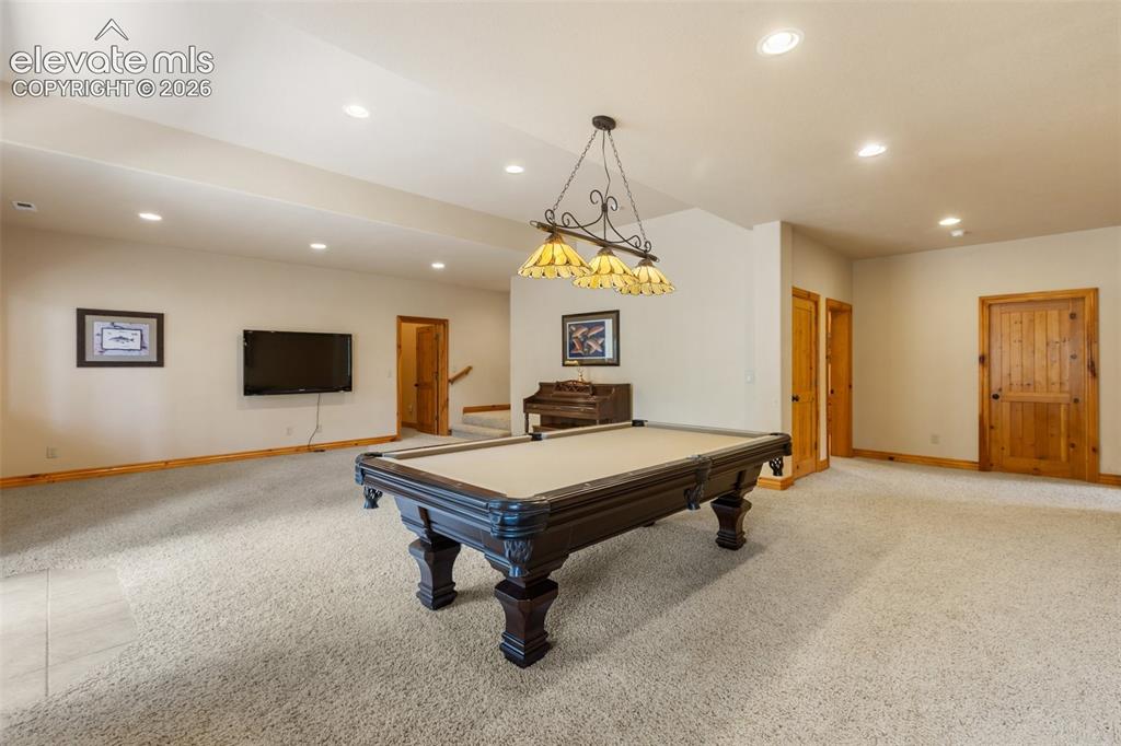 Image 32 of 50: Pool table, piano and TV all included as well as the billiard light and wal