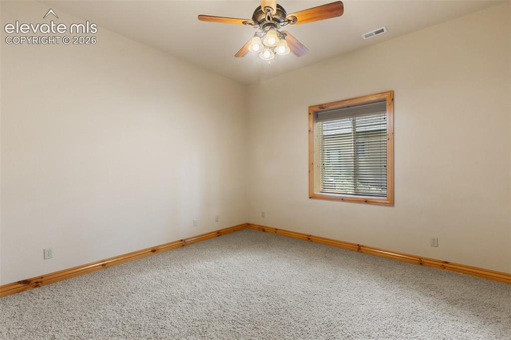 Image 36 of 50: Lower level 7th bedroom with double doors and large walk in closet. The ori