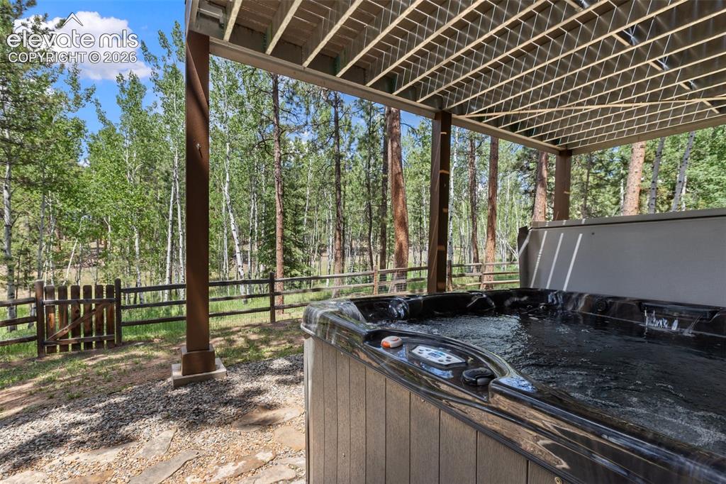 Image 40 of 50: Included is the 84"x84" CalSpa hot tub right outside your door.