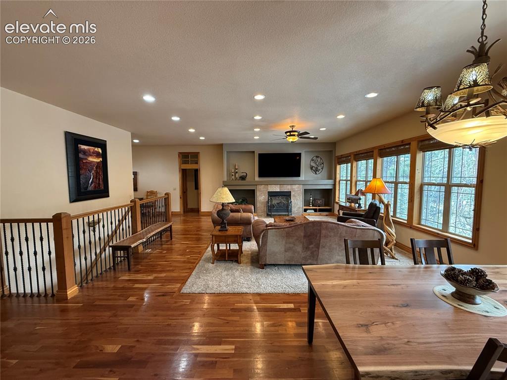Image 9 of 50: The living room opens to a casual dining area and the spacious kitchen.