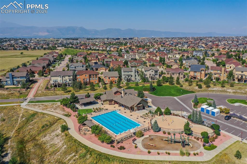 Image 41 of 46: Aerial perspective of suburban area with a pool