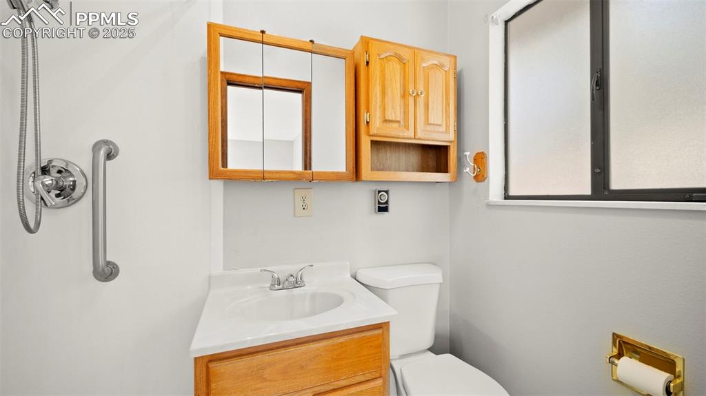 Image 22 of 50: Bathroom with vanity and toilet