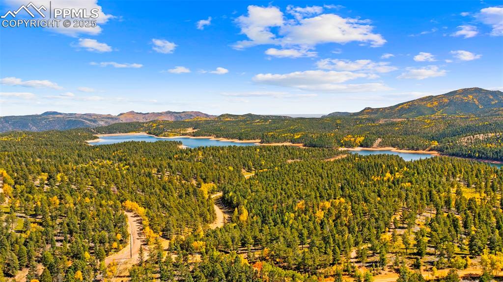 Image 48 of 50: View of mountain backdrop with a nearby body of water