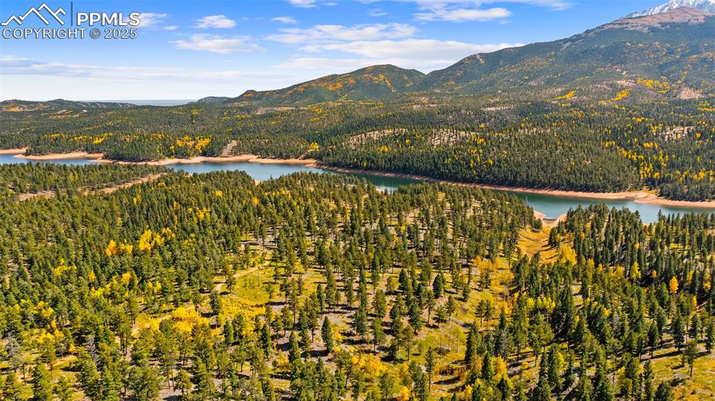 Image 5 of 50: View of mountain background featuring a large body of water