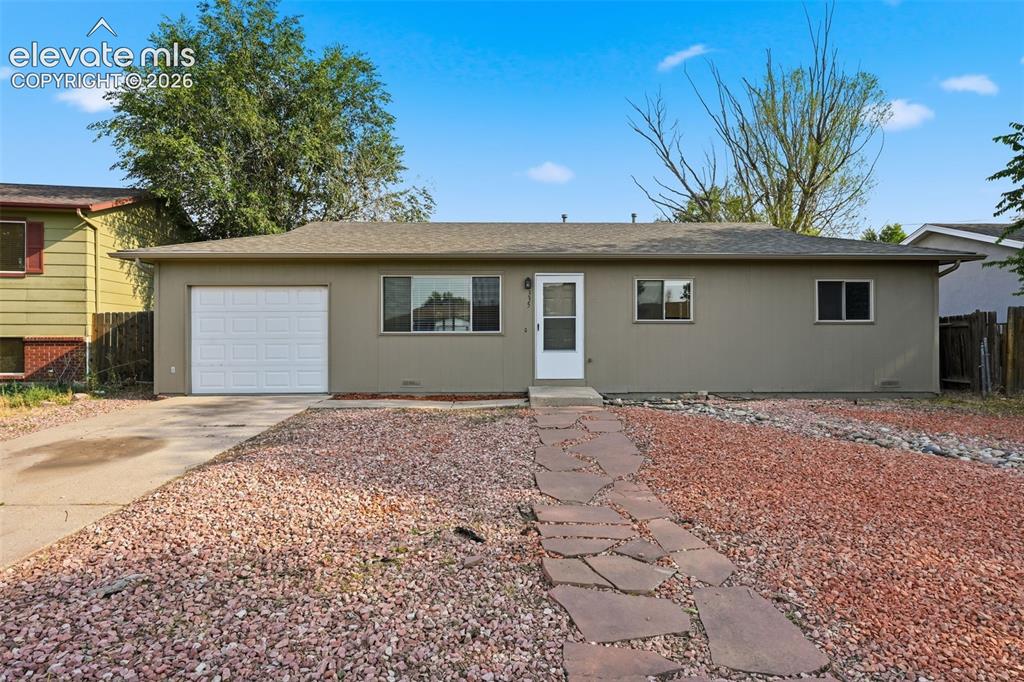 Image 3 of 36: Single-story residence featuring a front entry, attached garage with white 