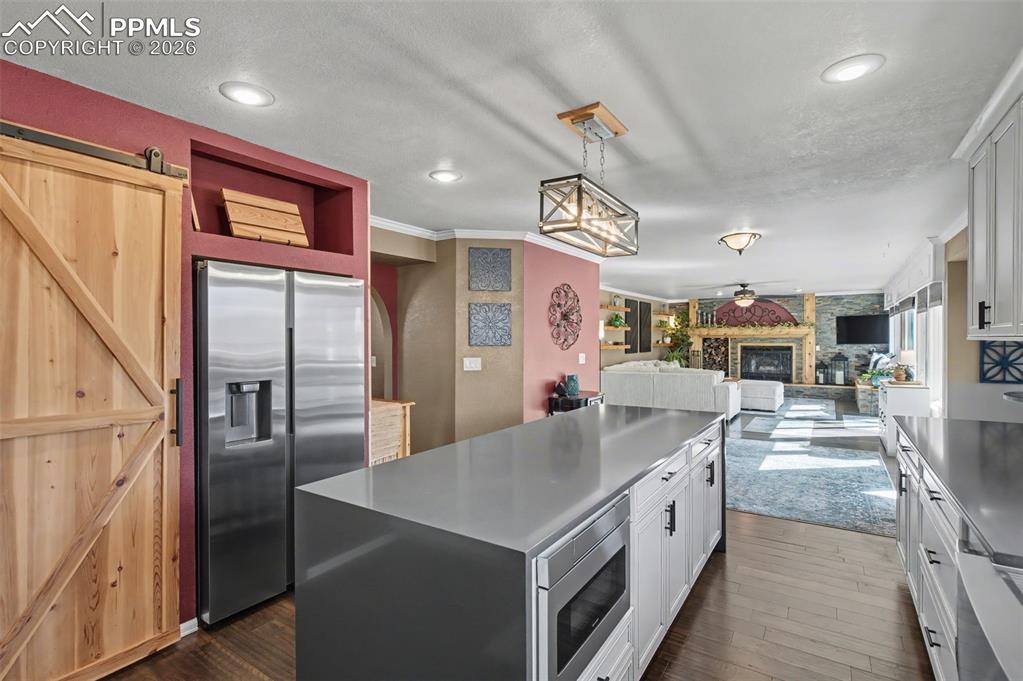 Image 16 of 50: Large pantry behind the barn door