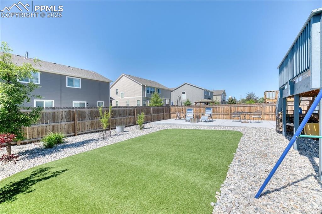 Image 33 of 39: View of yard featuring a residential view and a patio