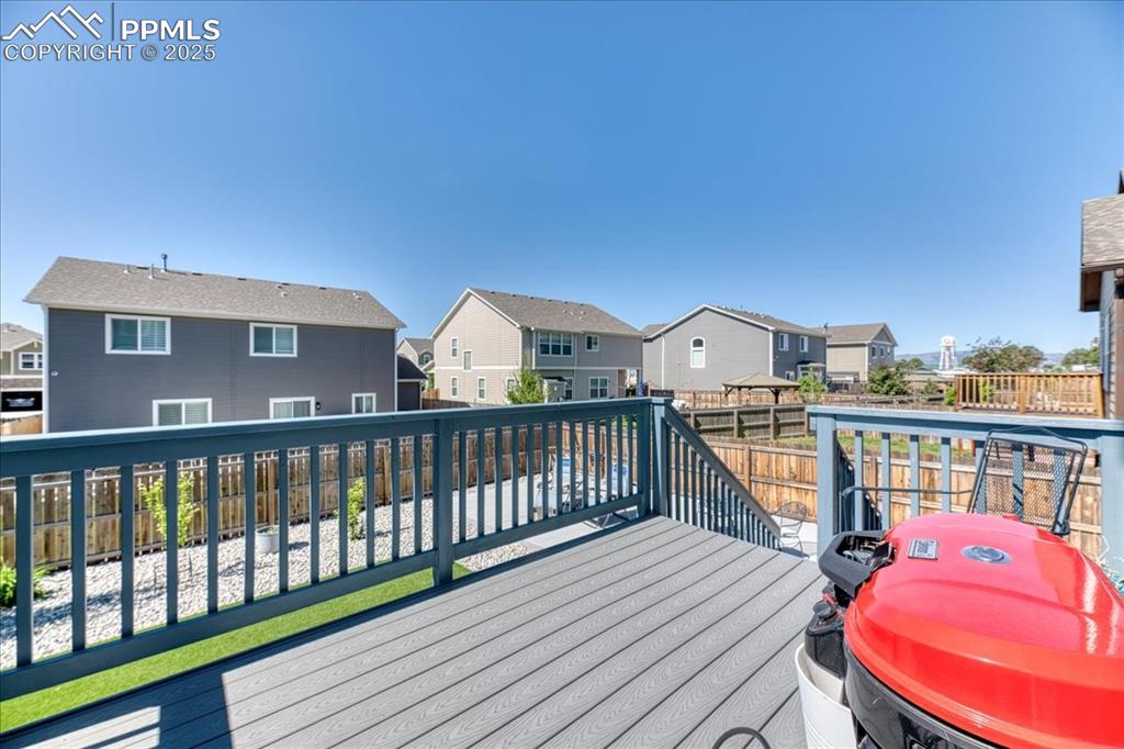 Image 36 of 39: Deck featuring a residential view, a fenced backyard, and grilling area