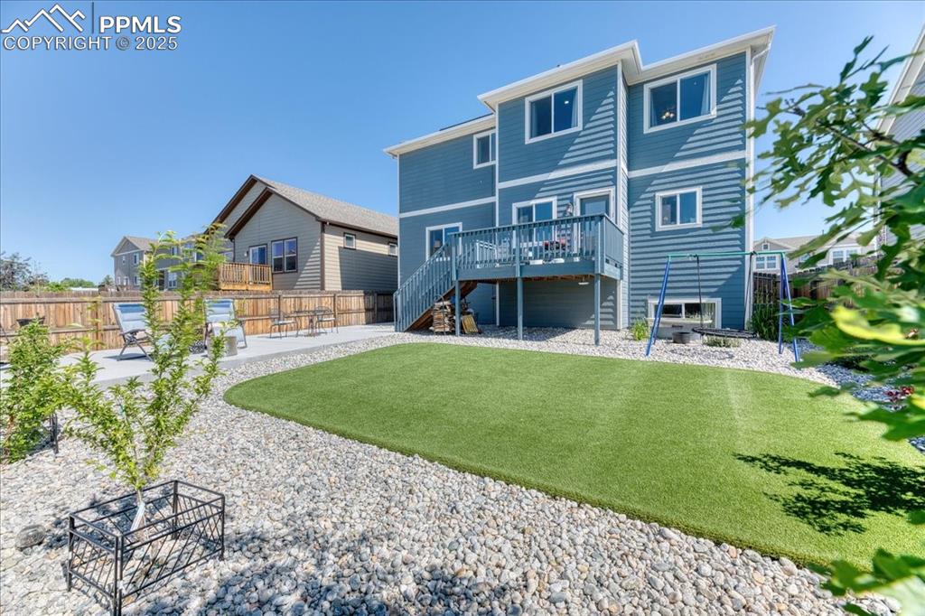 Image 39 of 39: Rear view of property with stairs, a patio area, and a wooden deck