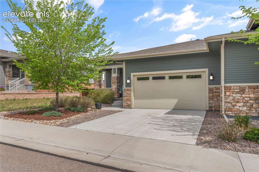 Image 1 of 38: Exterior featuring horizontal siding and stone veneer accents