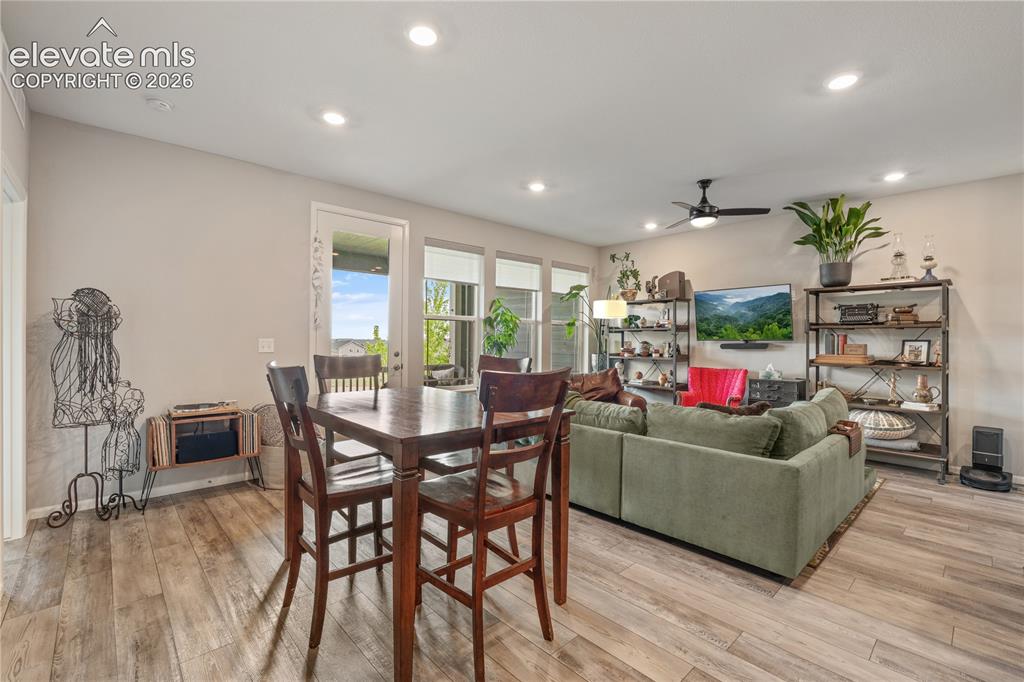 Image 17 of 38: Spacious interior featuring wood-finish flooring, recessed lighting, and a 